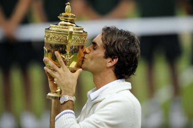 Here is Roger Federer with one of his trophies